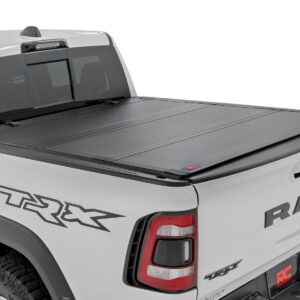 49320550 - Rough Country Hard Tri-Fold Flip Up Fold Bed Cover - Fits 5'7" Bed Dodge/Ram 1500 2019-2026/1500 TRX 2021-2024